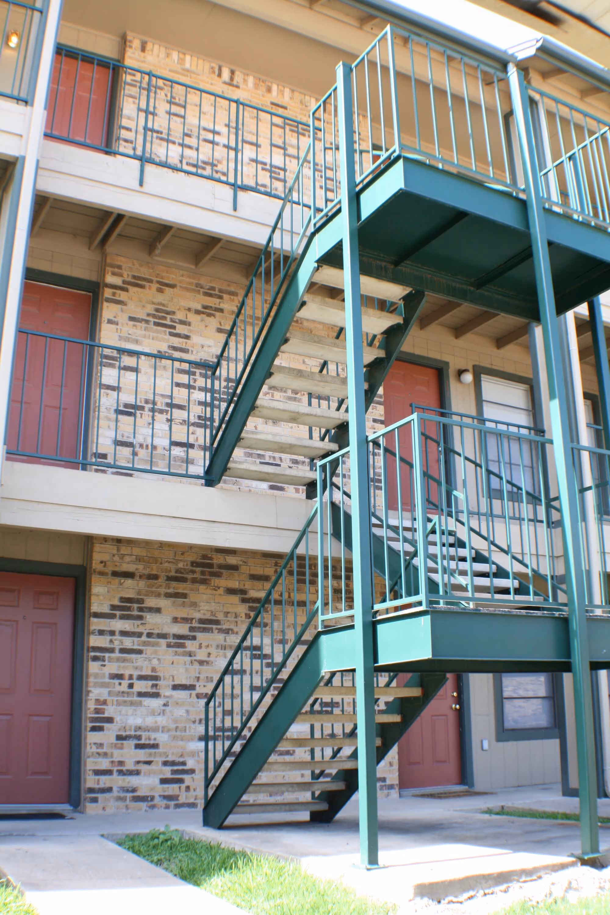 The staircases and front doors of apartment units at Stadium View.